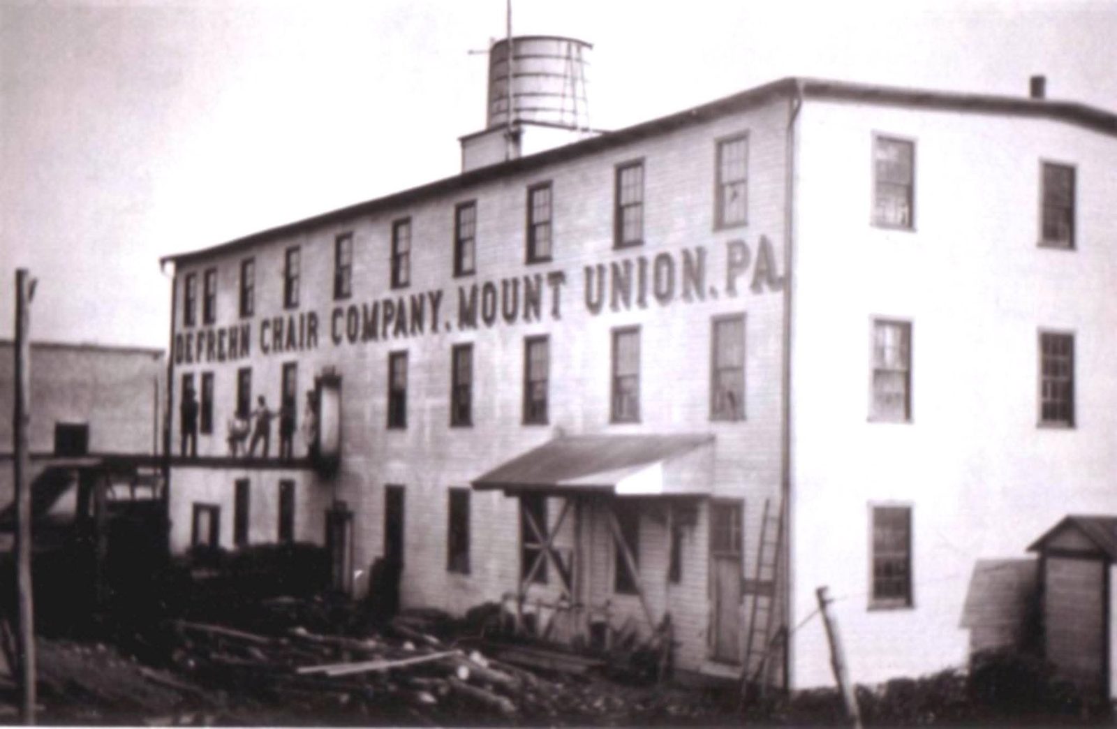 Defrehn Chair Company, Mount Union, Pa. &mdash; workers posed on the loading platform, water tower visible on the roof