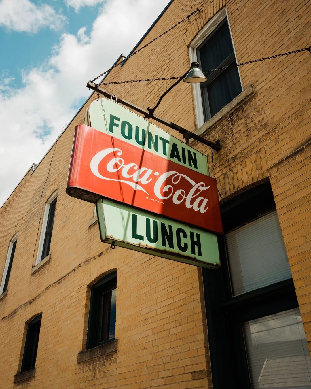 The Peduzzi Building's hanging fountain-lunch sign, up close